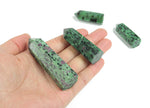 Ruby Zoisite obelisk tower crystal from GemstoneGO, showcasing a vibrant multicolored gemstone with a pointed tower shape.
