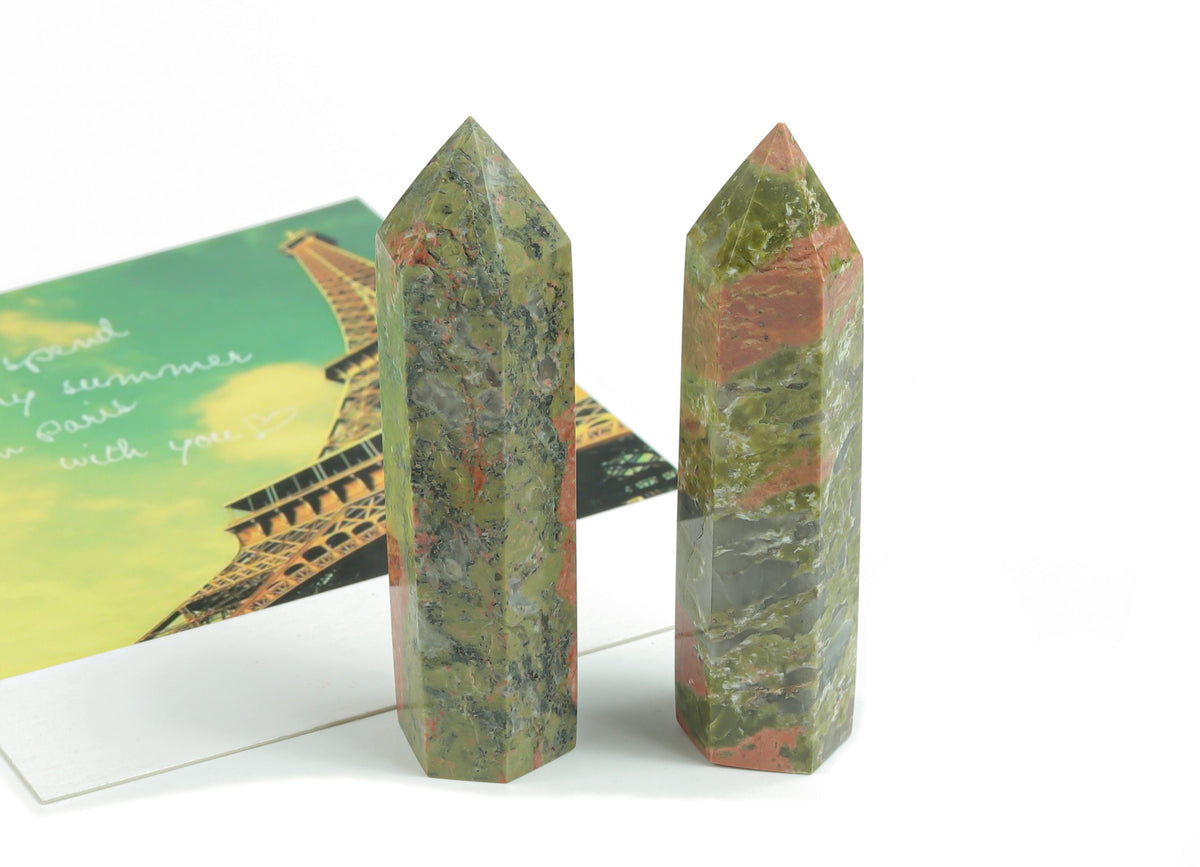 Unakite obelisk tower crystal from GemstoneGO, showcasing a polished green and pink gemstone obelisk with natural stone patterns.