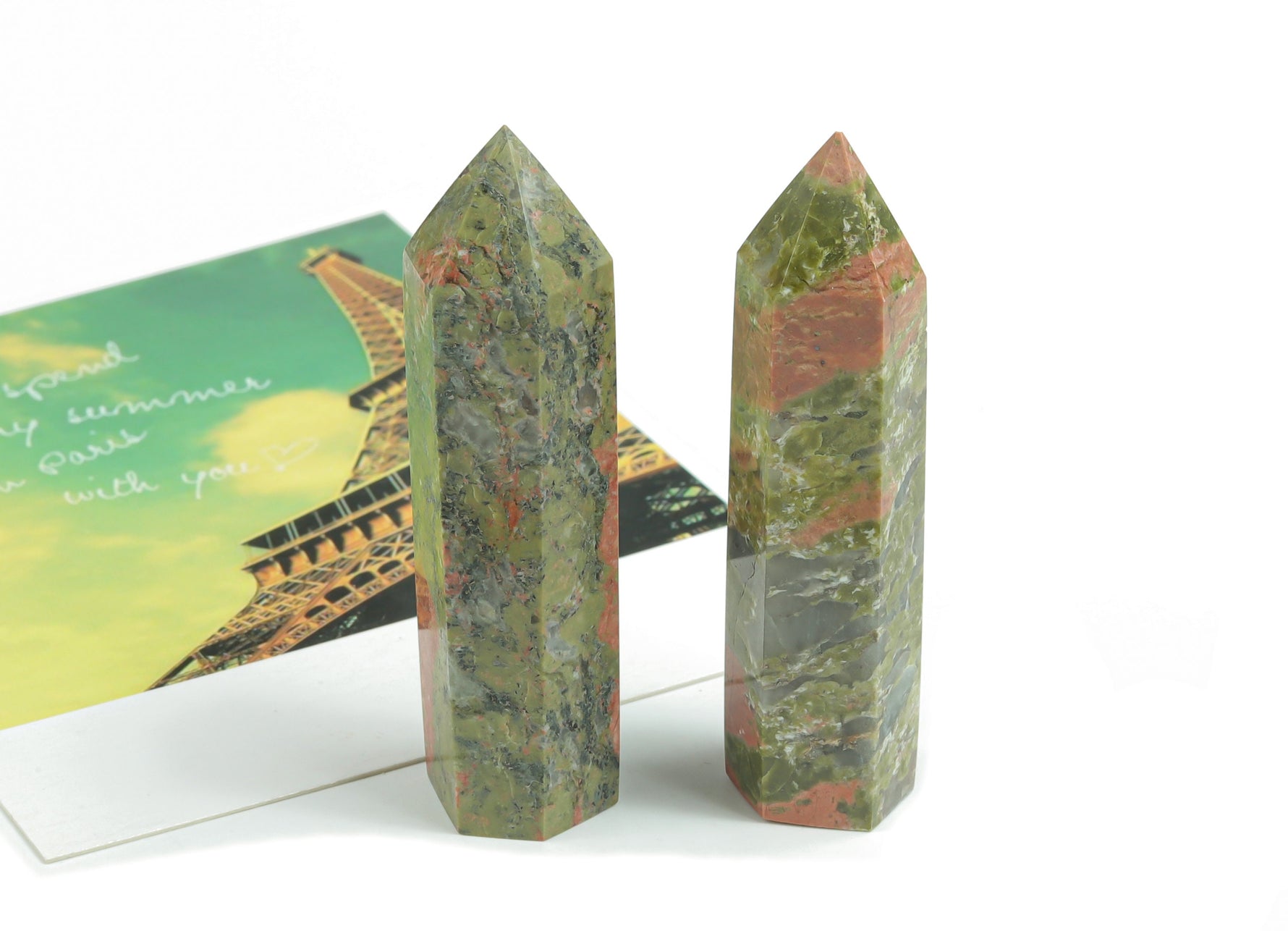Unakite obelisk tower crystal from GemstoneGO, showcasing a polished green and pink gemstone obelisk with natural stone patterns.