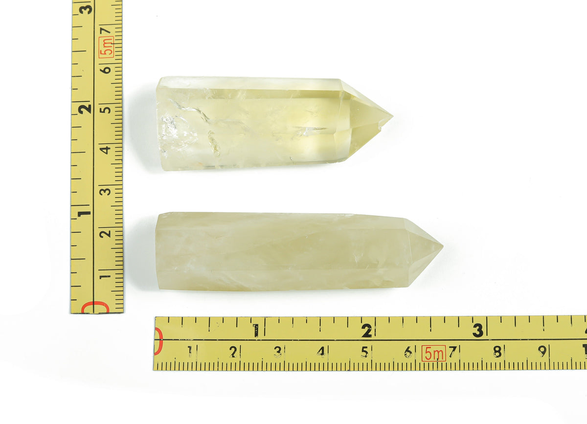 Citrine Obelisk Tower crystal from GemstoneGO, showing a vibrant yellow-orange gemstone with natural crystal formations.