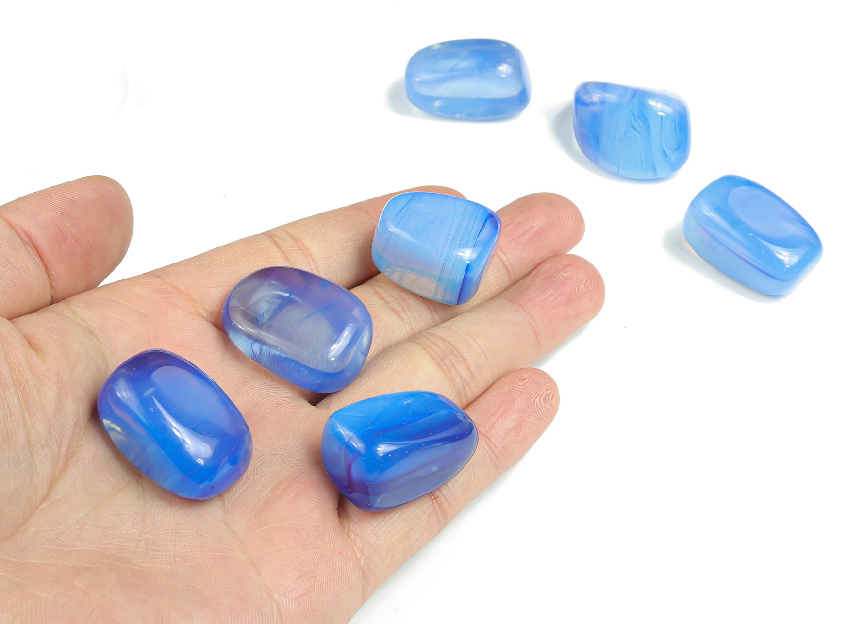 Blue Opalite tumbled stone from GemstoneGO with smooth, polished surface and vibrant blue color, ideal for healing and meditation.
