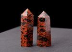 Mahogany Obsidian obelisk tower crystal from GemstoneGO, polished black and reddish-brown stone with natural texture.