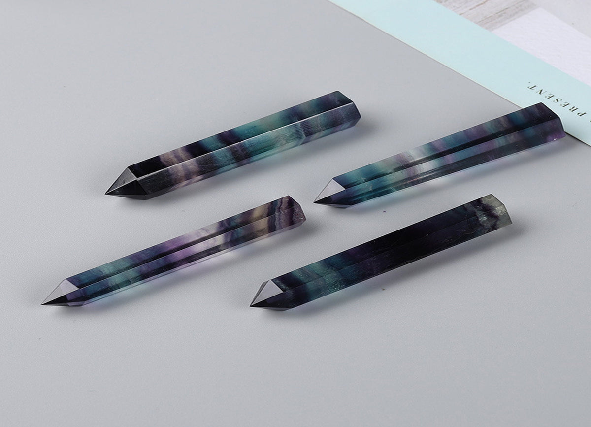 Rainbow fluorite obelisk tower crystal from GemstoneGO with vibrant rainbow colors and polished smooth surfaces.