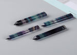 Rainbow fluorite obelisk tower crystal from GemstoneGO with vibrant rainbow colors and polished smooth surfaces.
