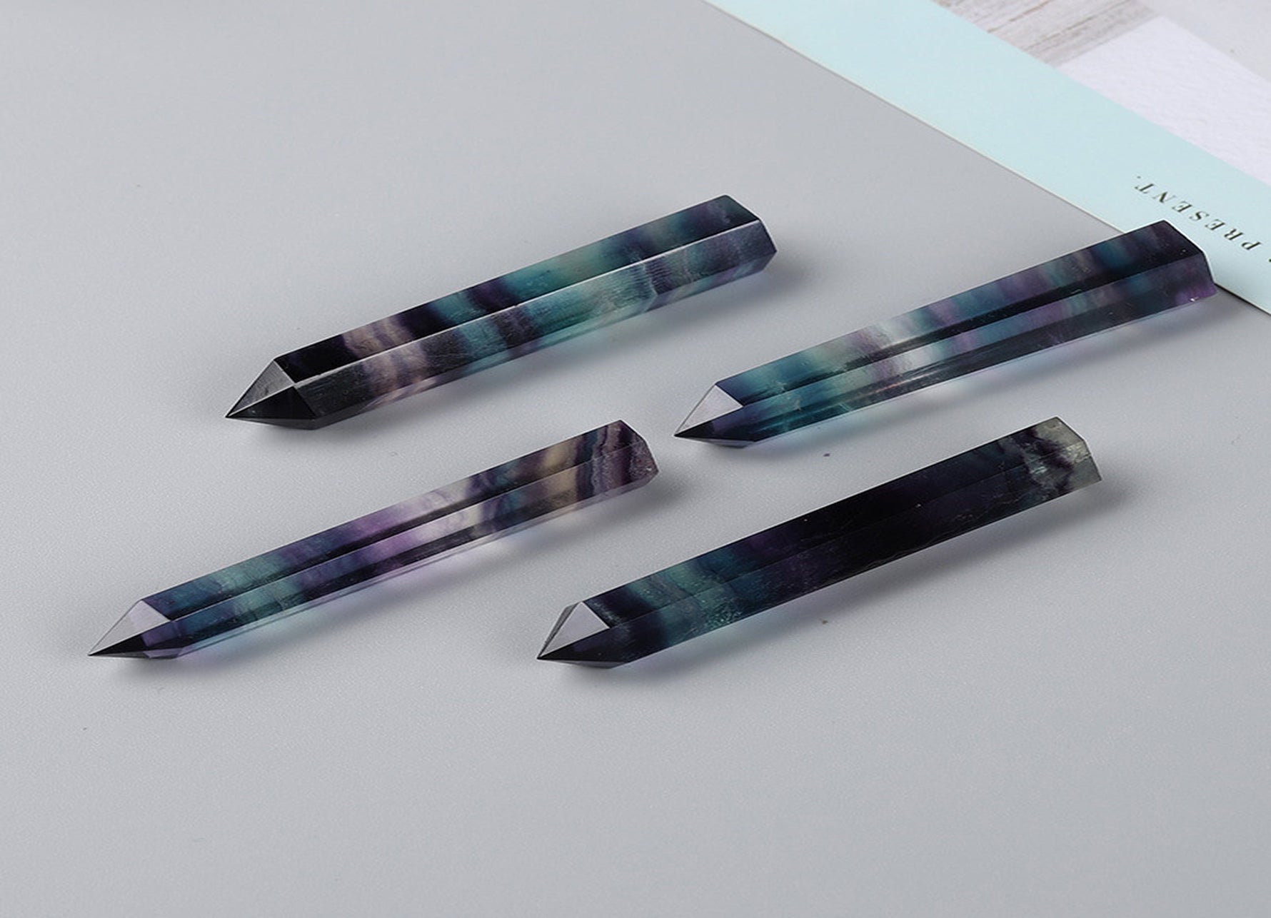 Rainbow fluorite obelisk tower crystal from GemstoneGO with vibrant rainbow colors and polished smooth surfaces.