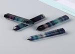 Rainbow fluorite obelisk tower crystal by GemstoneGO, showcasing vibrant rainbow colors and polished stone surface.
