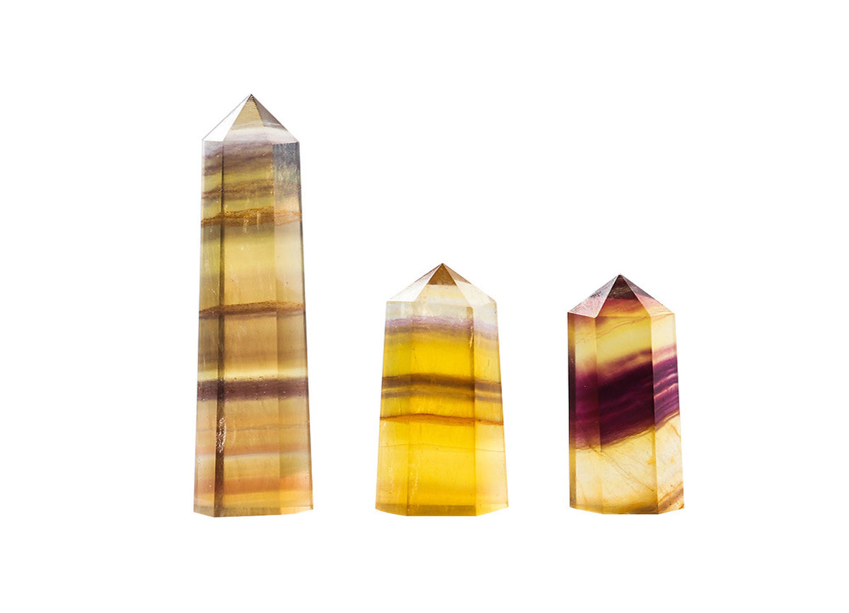 Yellow fluorite obelisk tower crystal from GemstoneGO, polished yellow gemstone with a pointed obelisk shape and natural crystal details.