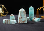 Blue Caribbean calcite druzý obelisk tower crystal from GemstoneGO with natural blue and white mineral patterns.