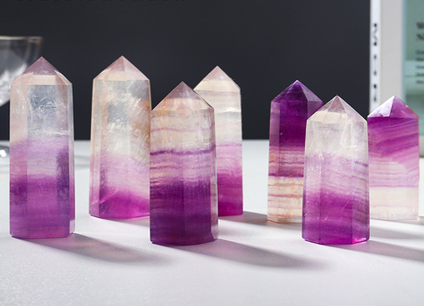 Watermelon fluorite obelisk tower crystal by GemstoneGO showing vibrant green and pink hues with a polished finish.