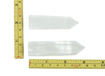 Clear Quartz obelisk tower crystal from GemstoneGO, showcasing a tall, transparent gemstone with natural crystal formations.