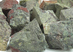 Raw Dragon Blood Jasper gemstone from GemstoneGO, showcasing deep red and brown natural mineral patterns.