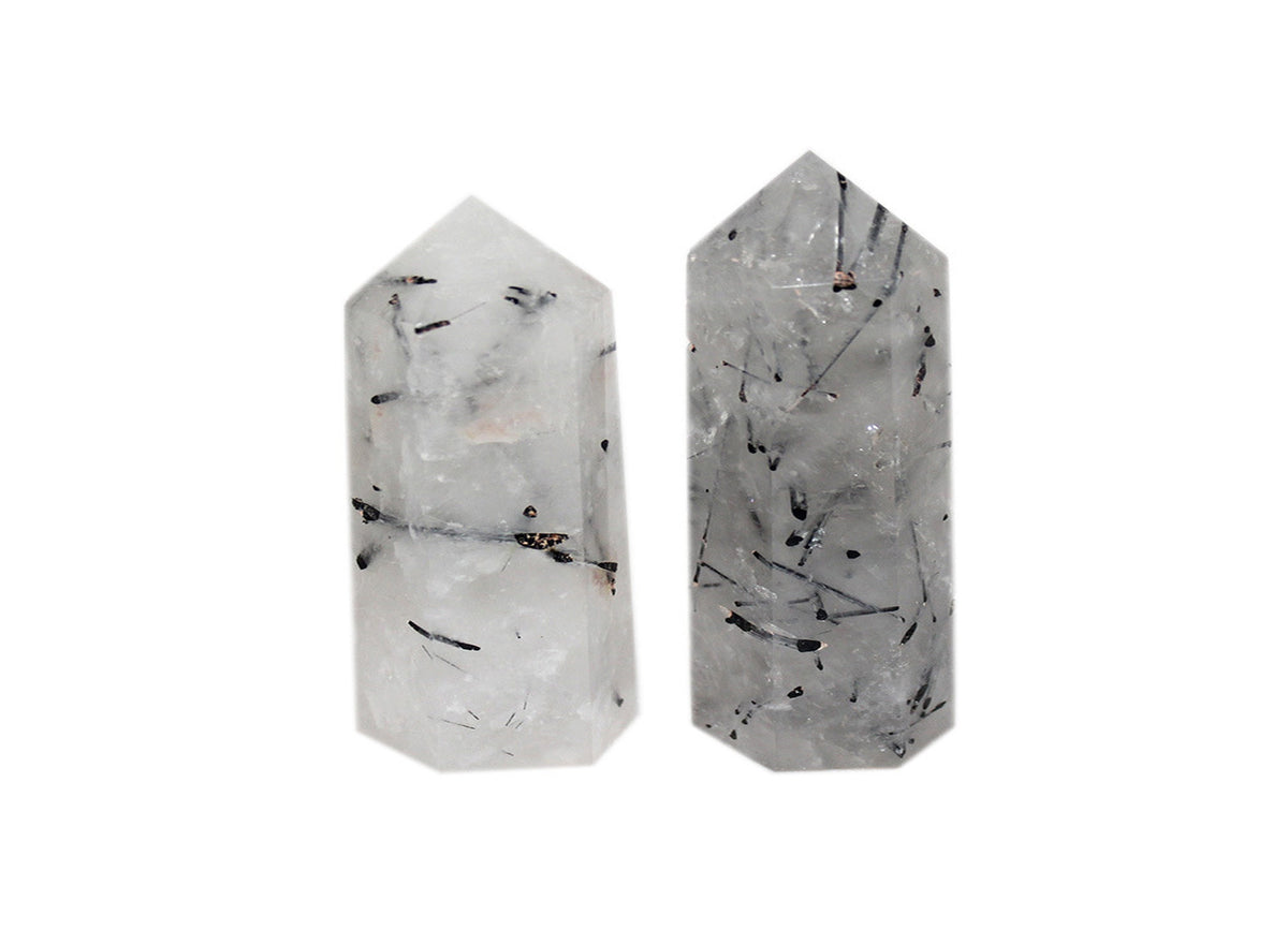 Tourmalinated Quartz obelisk tower crystal by GemstoneGO, featuring black tourmaline inclusions in clear quartz.