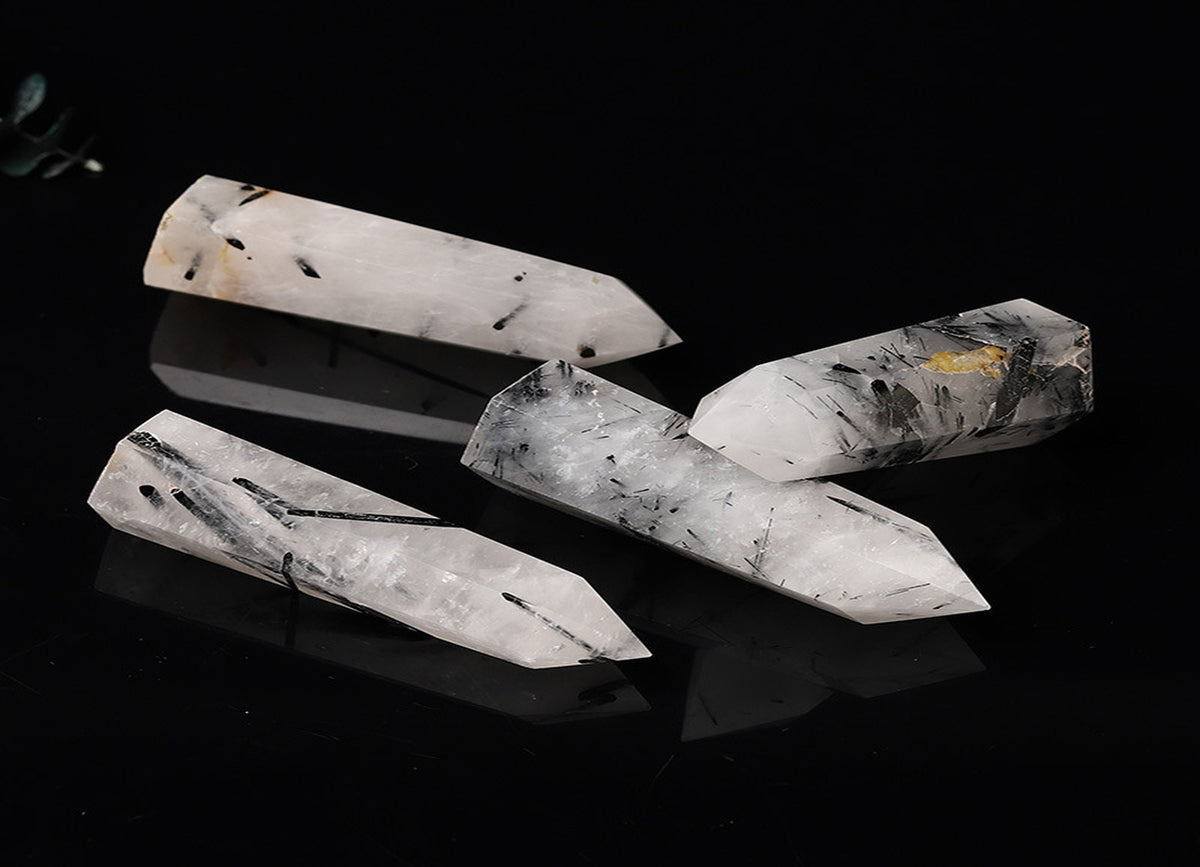 Tourmalinated Quartz obelisk tower crystal by GemstoneGO, showing black tourmaline inclusions in clear quartz stone.