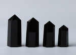 Obsidian Obelisk Tower crystal from GemstoneGO, showcasing a sleek black polished stone with natural gemstone features.