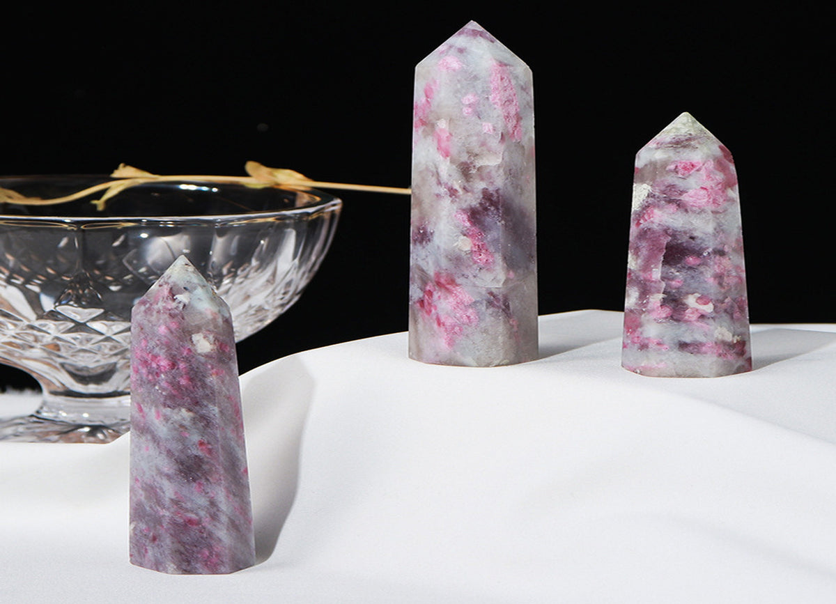 Plum blossom tourmaline obelisk tower crystal from GemstoneGO, showcasing pink and green hues with a polished pointed shape.