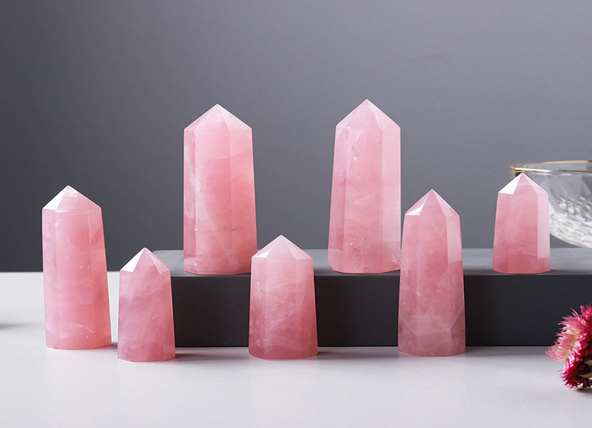 Rose Quartz obelisk tower crystal from GemstoneGO, showcasing a polished pink gemstone with natural crystal formations.