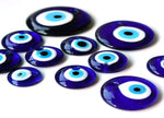 Blue glass evil eye pendant with hole for jewelry or home decor, featuring protective gemstone design by GemstoneGO.