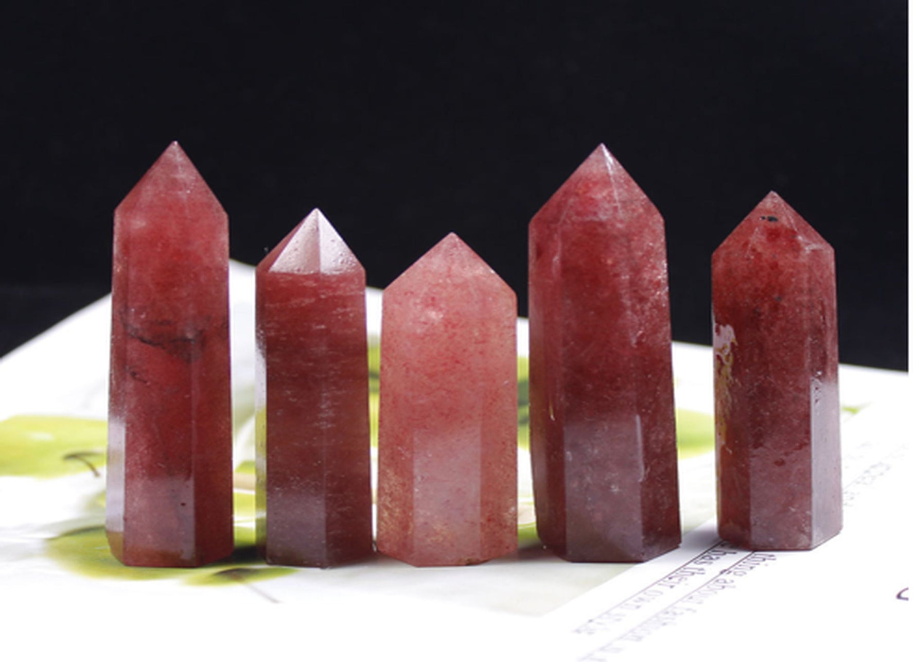 Strawberry Quartz obelisk tower crystal from GemstoneGO, featuring a polished pink gemstone with natural crystal formations.