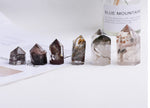 Lodolite Garden Quartz obelisk tower crystal from GemstoneGO, featuring a clear quartz point with mineral inclusions and natural formation
