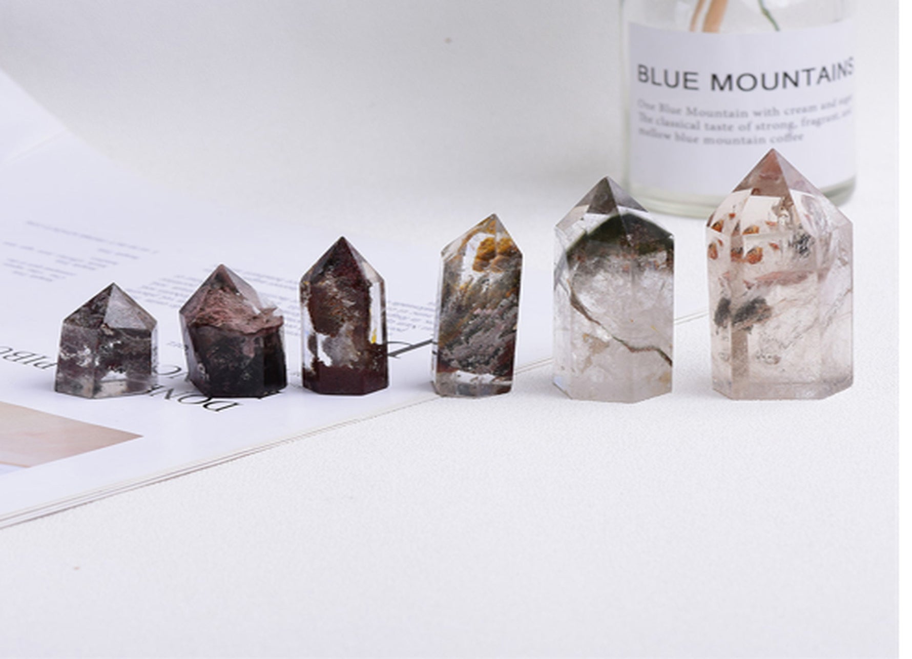 Lodolite Garden Quartz obelisk tower crystal from GemstoneGO, featuring a clear quartz point with mineral inclusions and natural formation