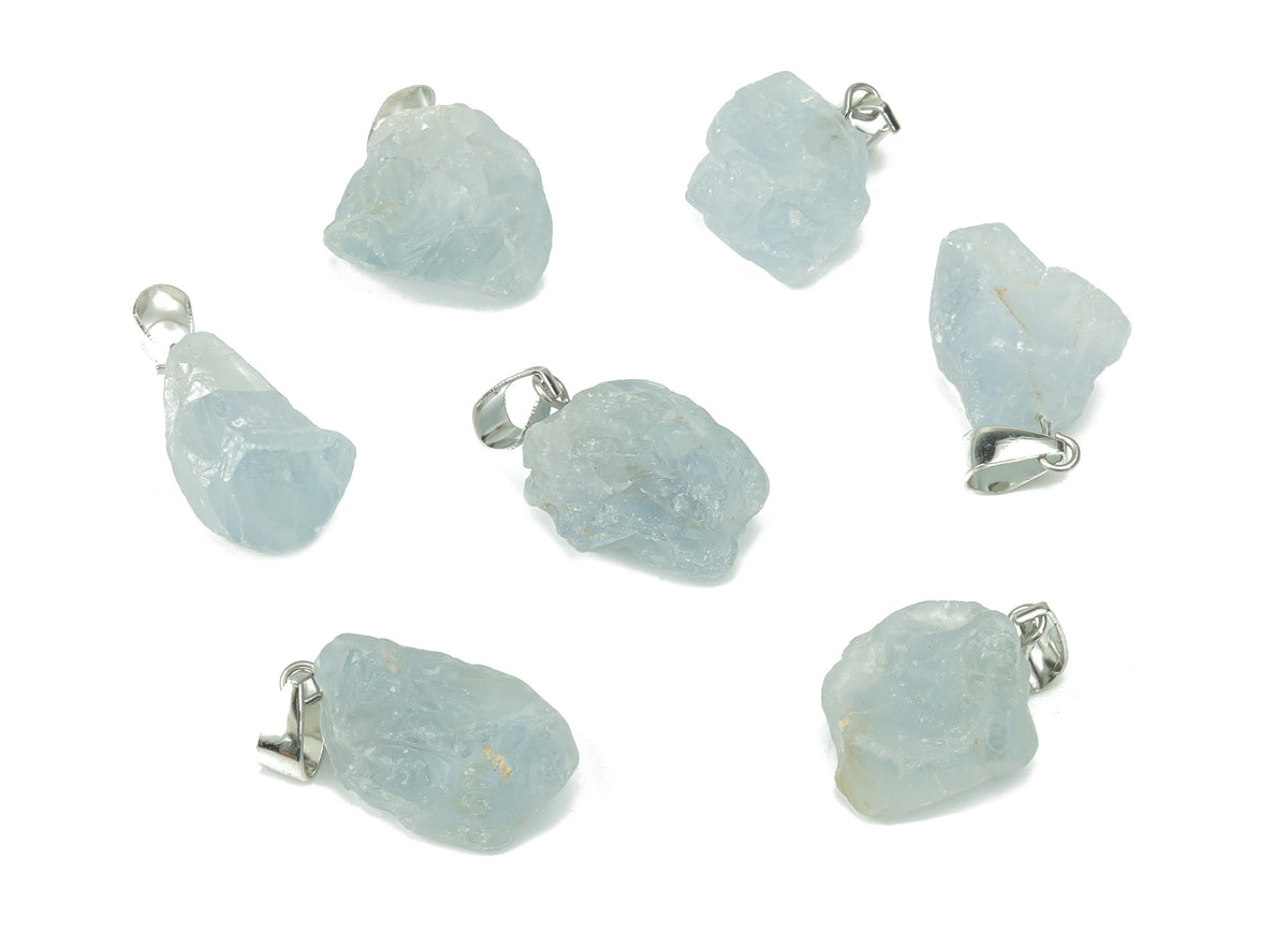 Celestite crystal pendant from GemstoneGO, showing a blue and white gemstone shaped for jewelry making on a jewelry-making supply background.
