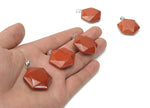 Red Jasper Star Merkaba crystal pendant from GemstoneGO, featuring a polished red jasper star-shaped pendant with a silver bail.