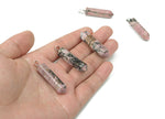 Rhodonite point crystal pendant from GemstoneGO, featuring a polished pink and black gemstone for jewelry making.