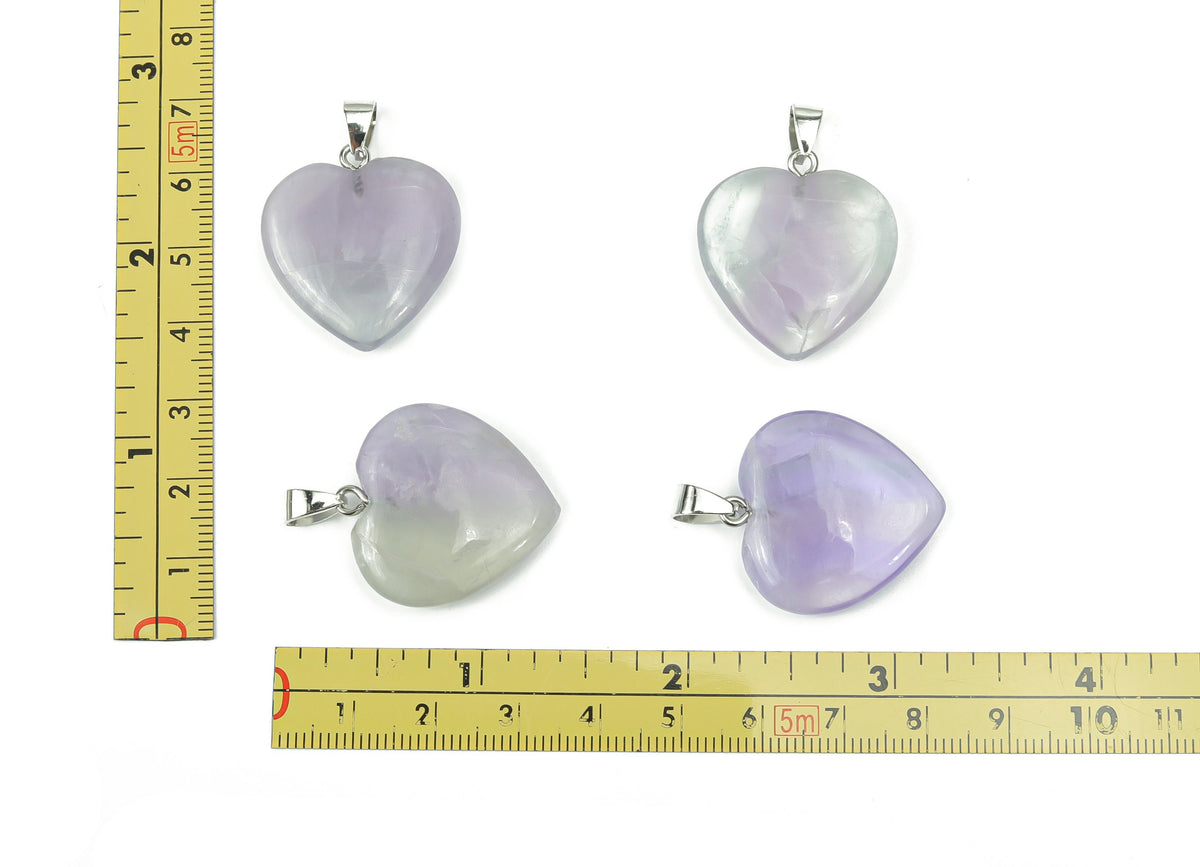 Pink fluorite heart crystal pendant from GemstoneGO, ideal for jewelry making, showcasing a polished pink fluorite heart-shaped gemstone.