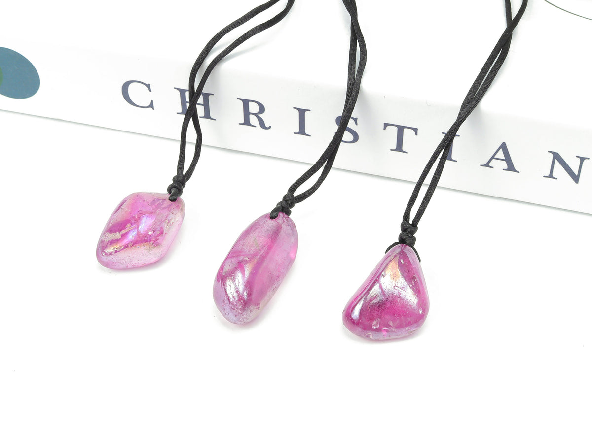 Purple Aura Quartz crystal necklace on a cord, showcasing vibrant purple gemstone, gemstone jewelry, and natural gemstone gift.