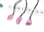 Purple Aura Quartz crystal necklace on a cord, showcasing vibrant purple gemstone, gemstone jewelry, and natural gemstone gift.