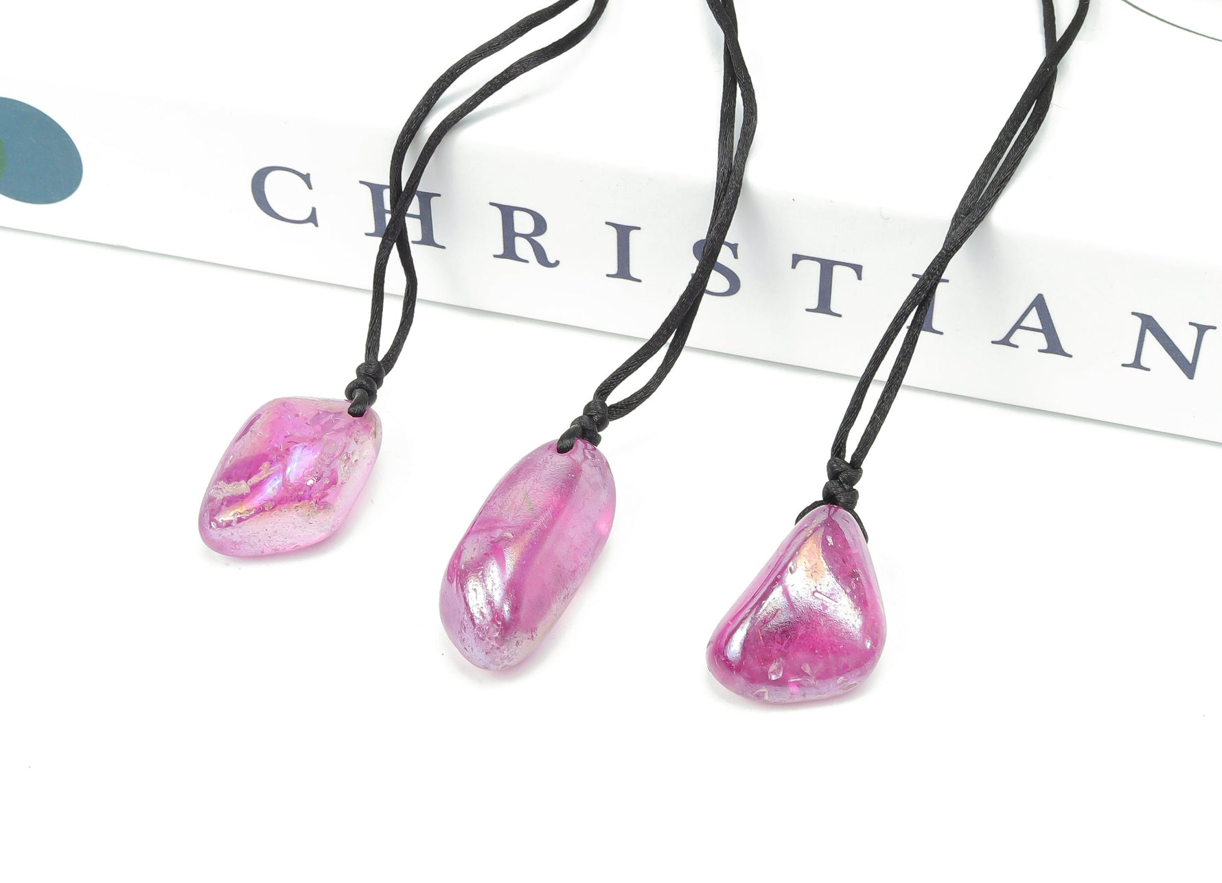 Purple Aura Quartz crystal necklace on a cord, showcasing vibrant purple gemstone, gemstone jewelry, and natural gemstone gift.