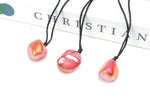 Red Aura Quartz crystal necklace on a cord, showcasing vibrant red gemstone with a polished finish, by GemstoneGO.