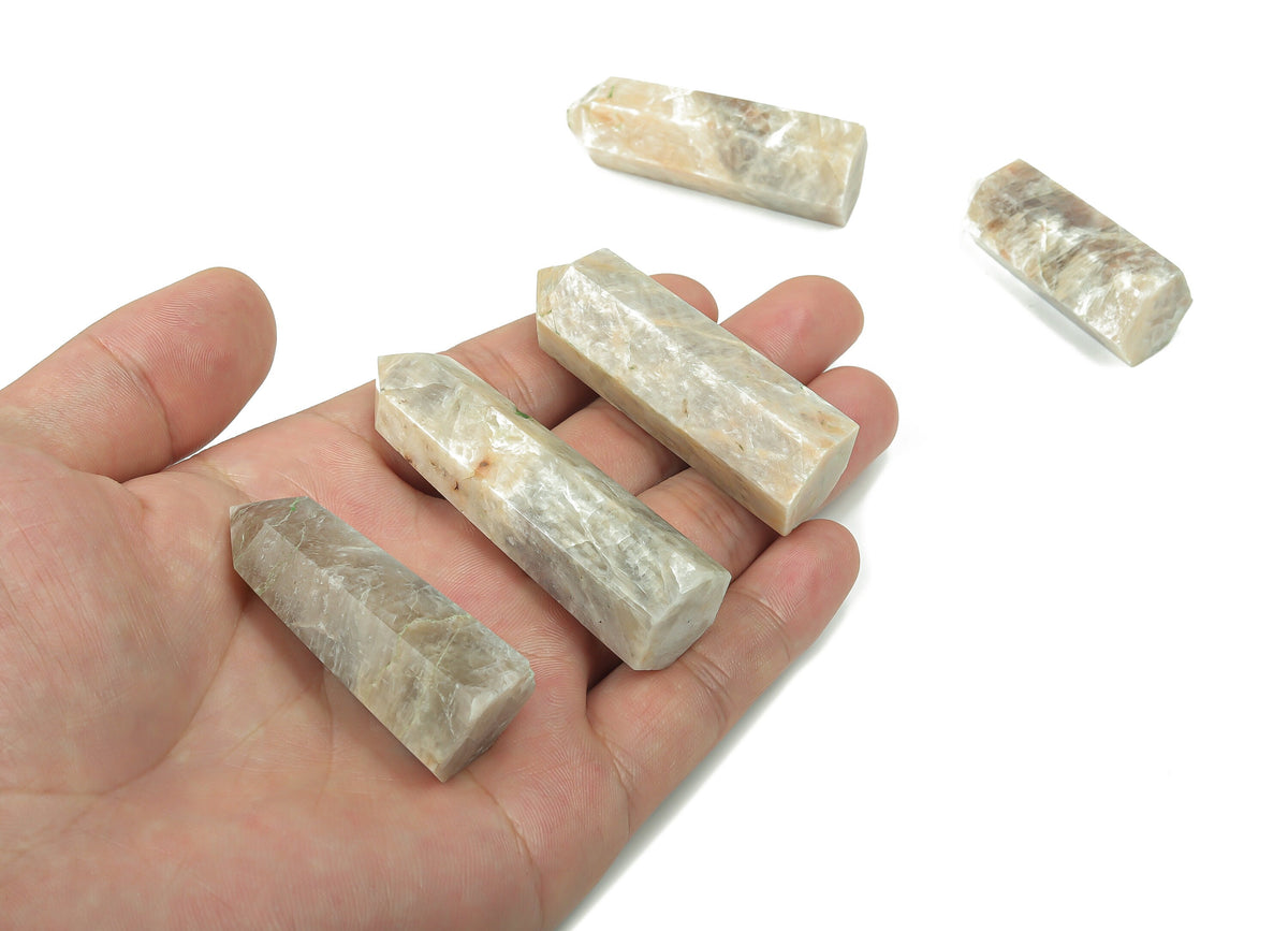 Moonstone obelisk tower crystal from GemstoneGO, featuring a smooth, polished moonstone with natural shimmer and veining.