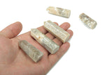 Moonstone obelisk tower crystal from GemstoneGO, featuring a smooth, polished moonstone with natural shimmer and veining.