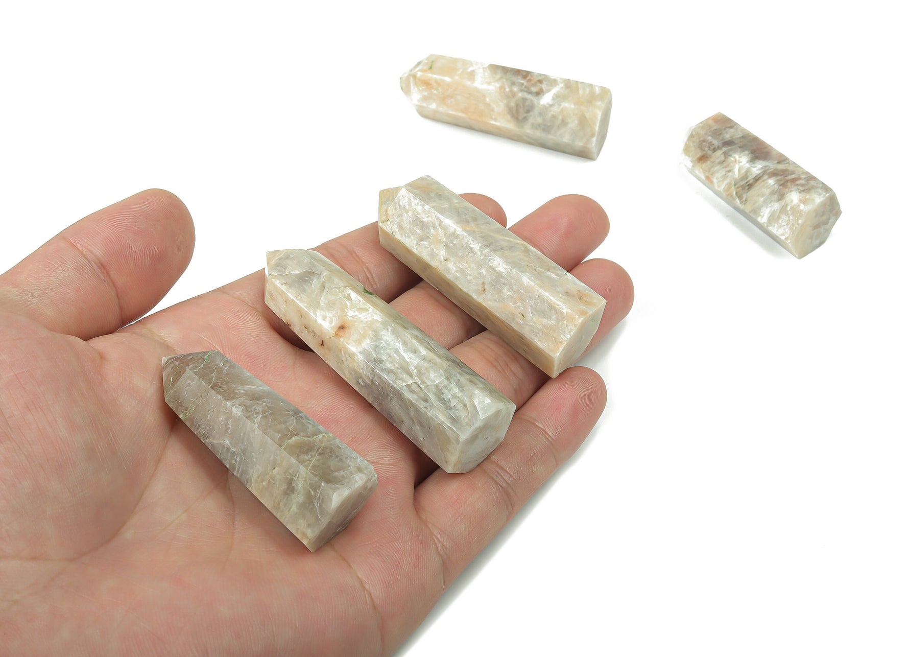 Moonstone obelisk tower crystal from GemstoneGO, featuring a smooth, polished moonstone with natural shimmer and veining.