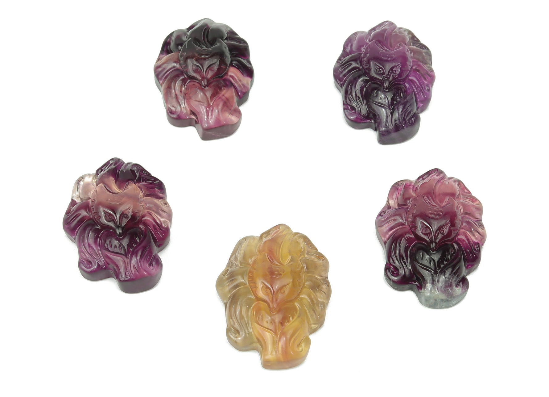 Polished fluorite gemstone carved into a nine-tailed fox figure, showcasing vibrant colors and intricate detailing from GemstoneGO.