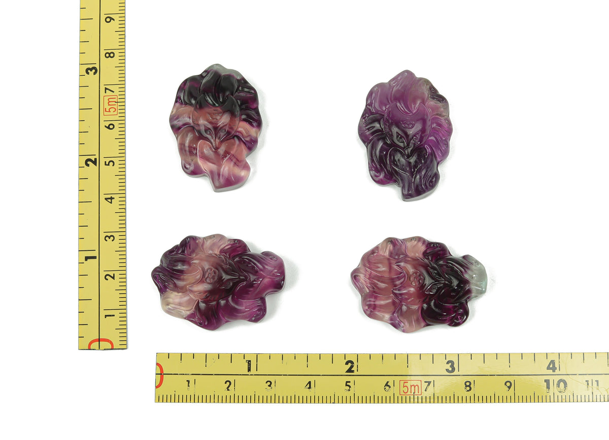Fluorite nine-tailed fox gemstone carving from GemstoneGO, detailed multicolored natural stone sculpture on a neutral background.