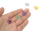 Fluorite gingerbread cookies carving gemstone by GemstoneGO showing a colorful, detailed carved fluorite gemstone with gingerbread cookie design.