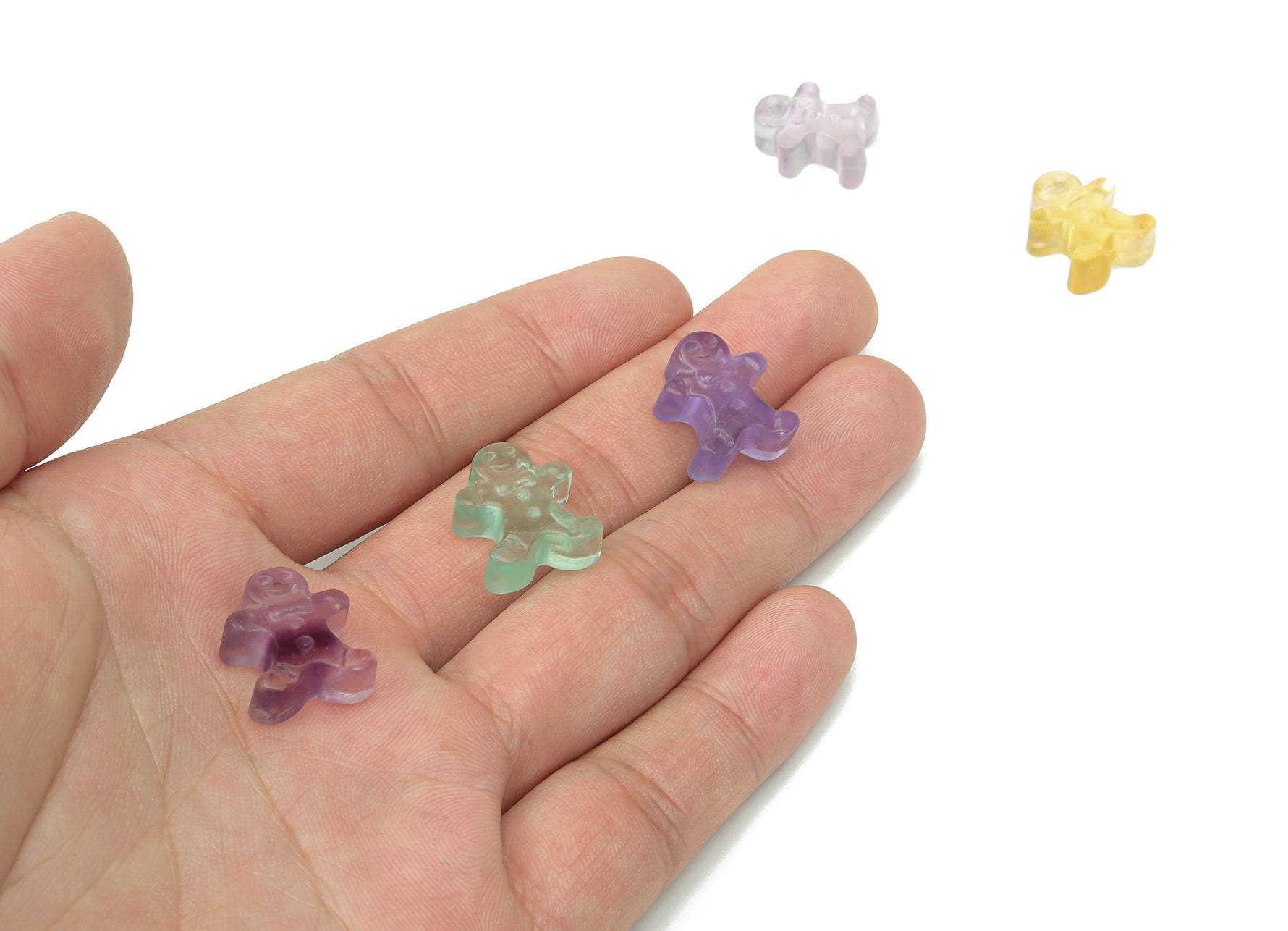 Fluorite gingerbread cookies carving gemstone by GemstoneGO showing a colorful, detailed carved fluorite gemstone with gingerbread cookie design.