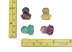 Fluorite angel kid gemstone carving by GemstoneGO showing a colorful, detailed angel figure with smooth polished surface.