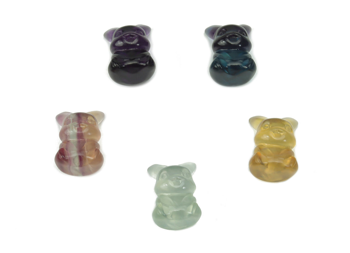 Colorful fluorite gemstone carved into a cute animal figure, showcasing vibrant hues and detailed craftsmanship by GemstoneGO.