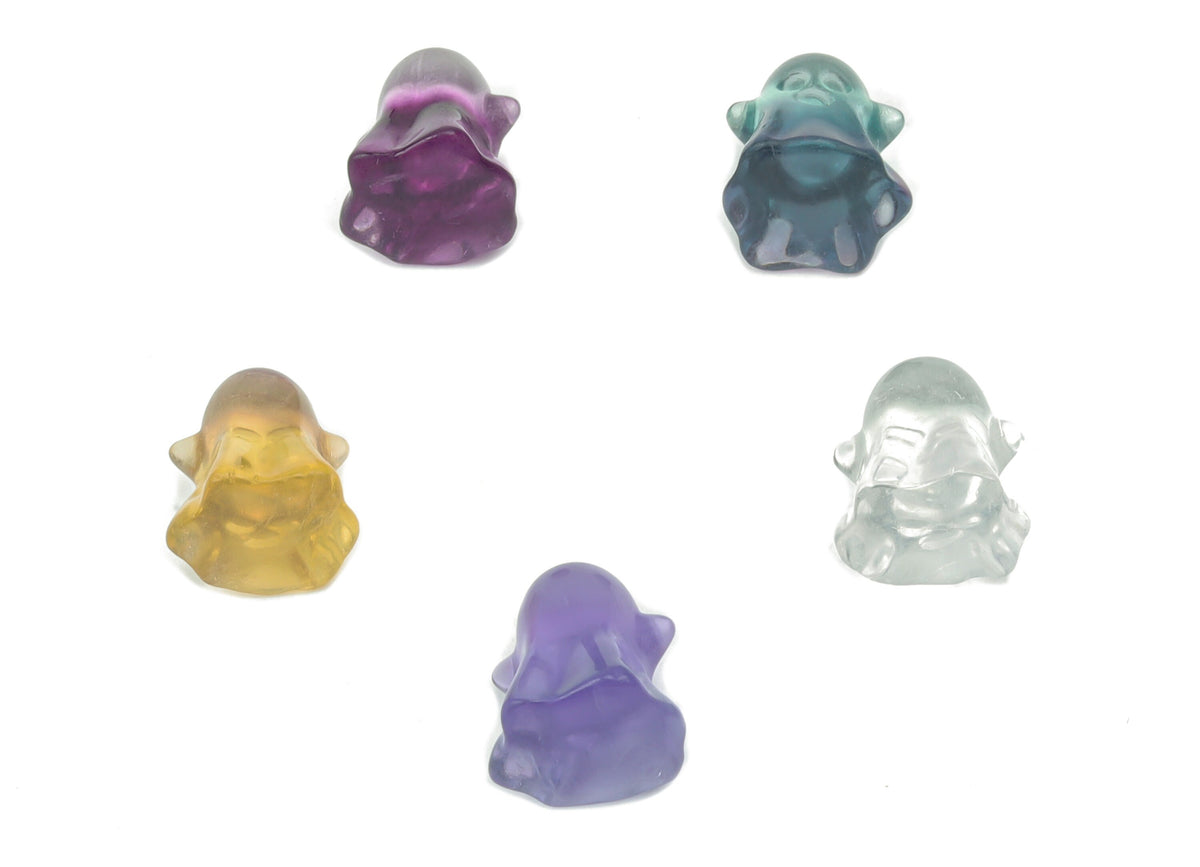 Mini fluorite ghost carving gemstone by GemstoneGO, showcasing a vibrant purple and green fluorite figurine with intricate details.