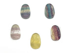 Mini Fluorite Buddha carving gemstone from GemstoneGO, showing detailed purple and green mineral hues and intricate Buddha figure design.