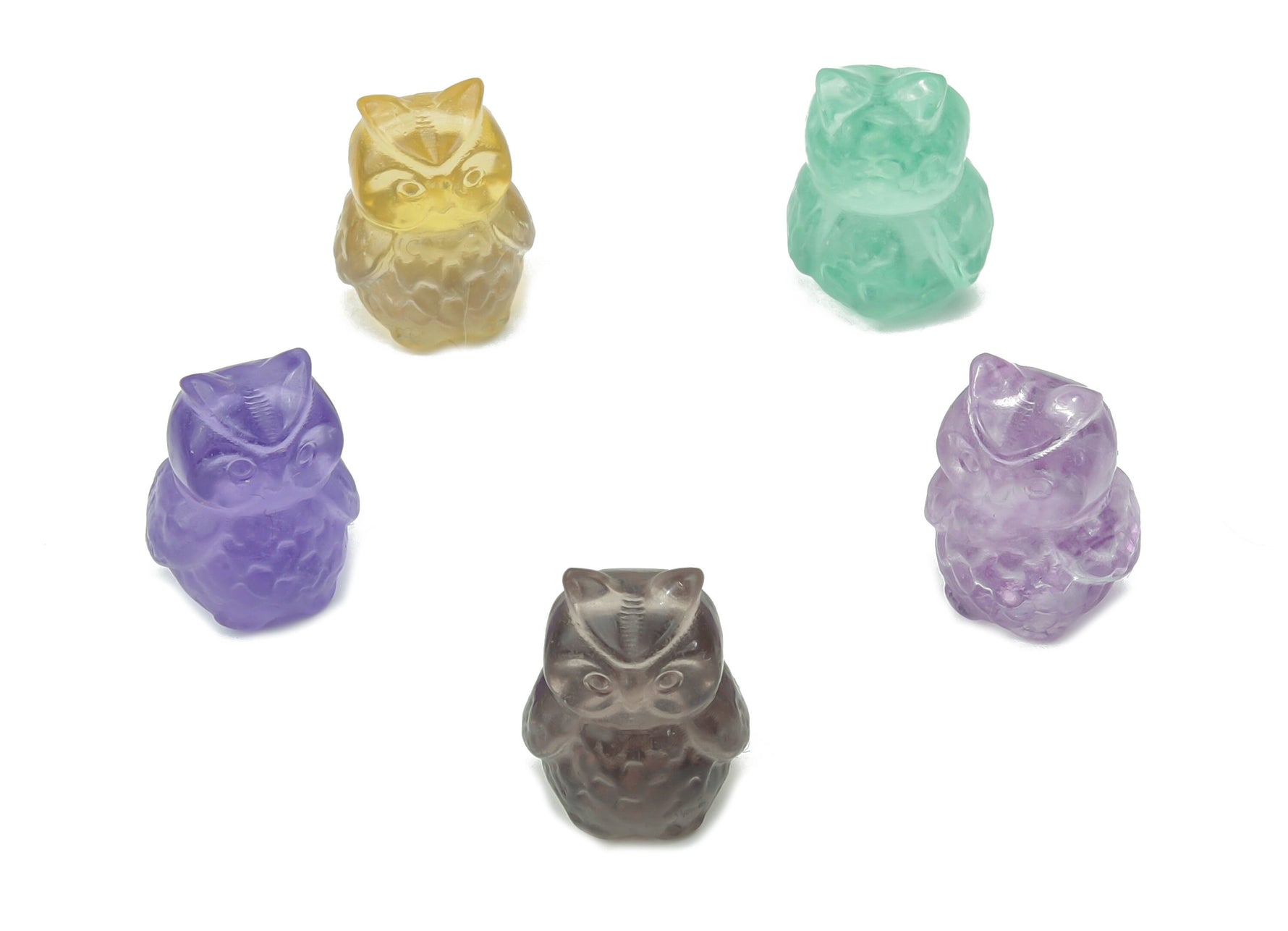 Fluorite owl carving gemstone from GemstoneGO showcasing a colorful, polished owl sculpture with vibrant purple and green hues.