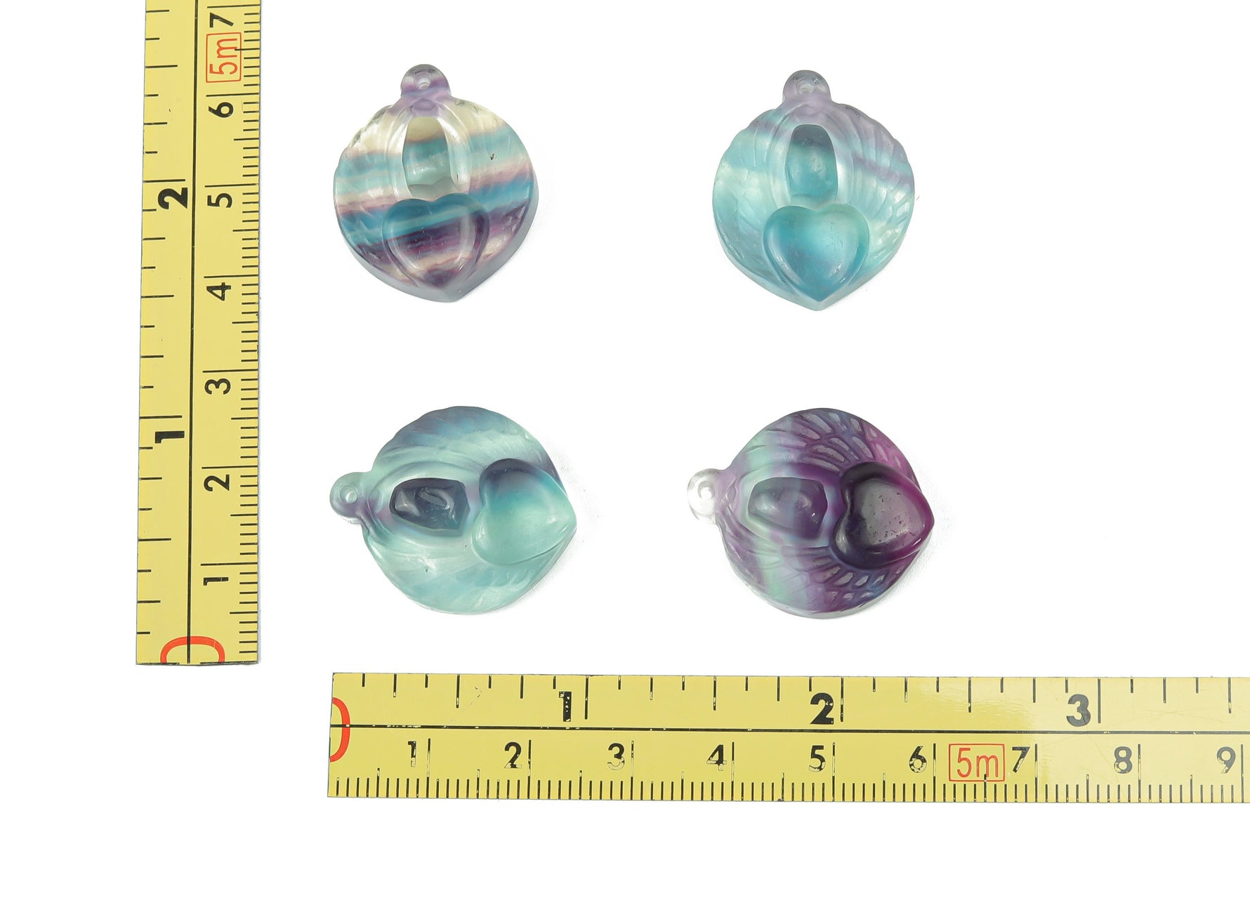 Purple fluorite heart-shaped crystal pendant with a hole, crafted by GemstoneGO, showcasing a polished, vibrant gemstone design.