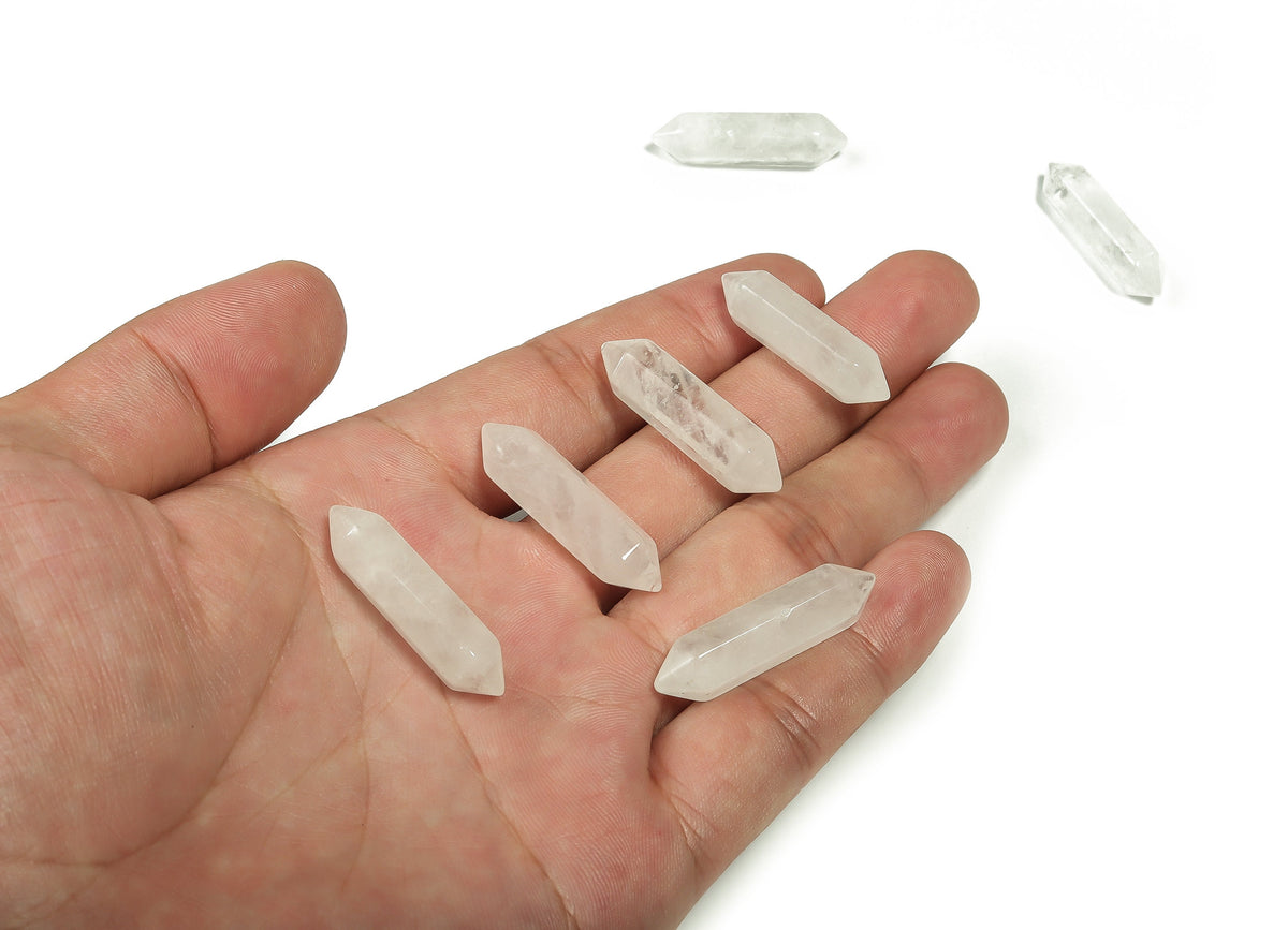 Clear quartz terminated carved point gemstone from GemstoneGO, 33mm, showcasing a polished, natural crystal with pointed ends.