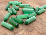 Green Cats Eye terminated carved gemstone point, 33mm, from GemstoneGO, showcasing smooth polished surface with natural banding and shine.
