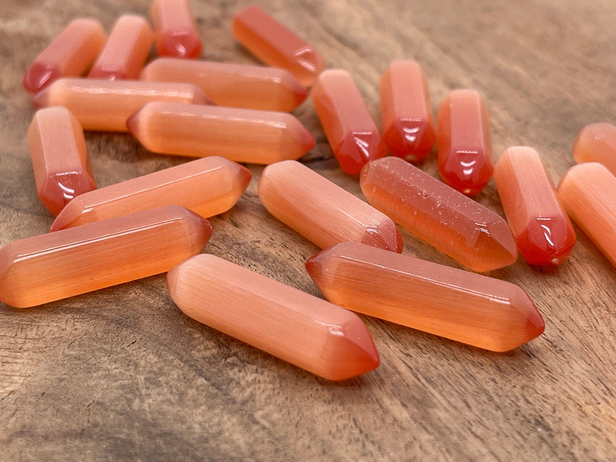 Orange Cats Eye gemstone carved point, 33mm, with vibrant orange color and cat's eye shimmer, from GemstoneGO.