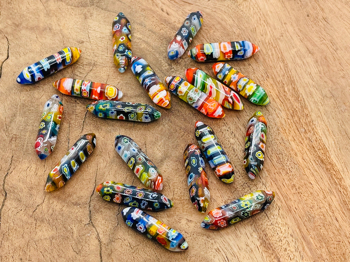 Murano glass terminated carved point gemstone from GemstoneGO, 3cm, with intricate details and vibrant colors.