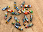 Murano glass terminated carved point gemstone from GemstoneGO, 3cm, with intricate details and vibrant colors.
